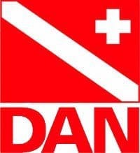 Diver-Alert-Network_resized DAN logo: red square with white diagonal diver-down stripe, white medical cross at top-right, and 'DAN' in red letters below.